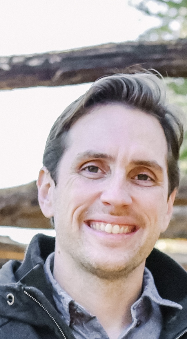 A man smiling into the camera