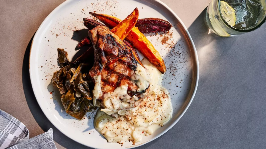 Smothered Pork Chop, Stewed Collards and Yams (Tim Robison)