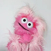 A furry pink puppet