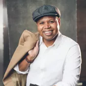 A man smiling into the camera