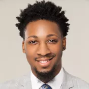A man smiling into the camera