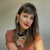 A woman smiling into the camera