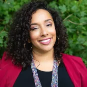 A woman smiling into the camera