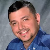 A man smiling into the camera