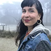 A woman smiling into the camera