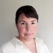 A woman smiling into the camera