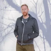 A man smiling into the camera