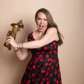 Woman swinging a saxophone.