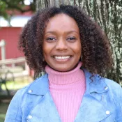 A woman smiling into the camera