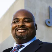 A man smiling into the camera