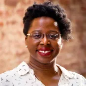 A woman smiling into the camera