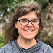 A woman smiling into the camera