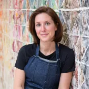 A woman smiling into the camera
