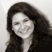 A woman smiling into the camera