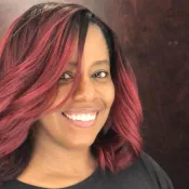 A woman smiling into the camera
