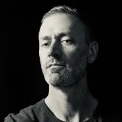 Person with short hair and a beard.