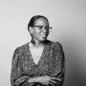 A woman smiling into the camera