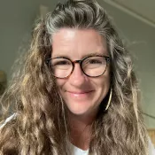 A woman smiling into the camera
