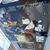 Posing in front of mural