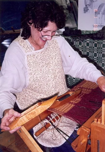 Leveille weaving and smiling