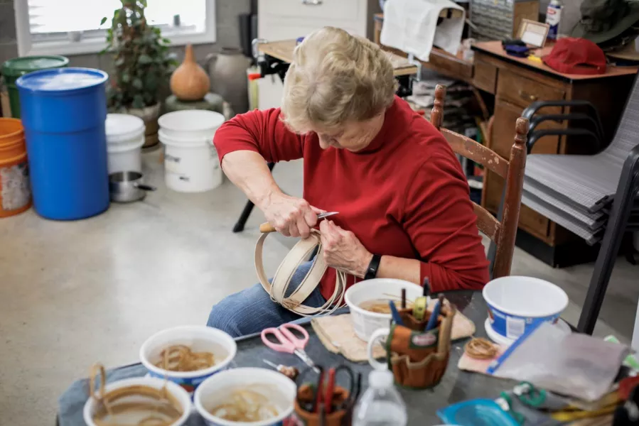 Sue working on a basket