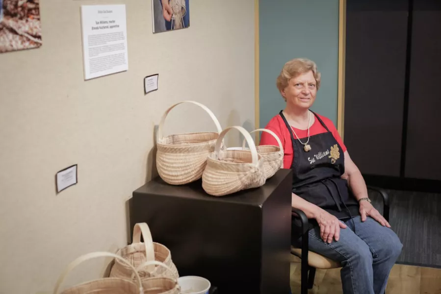 Sue Williams poses with baskets