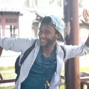 A man striking a pose and smiling