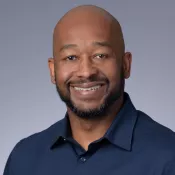 A man smiling into the camera